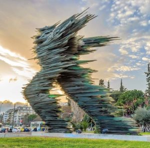 VAROTSOS - Athens, Greece, The RUNNER sculpture, glass & iron pieces, 7.3m